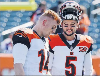  ?? [FRANK VICTORES/THE ASSOCIATED PRESS] ?? Cincinnati Bengals quarterbac­ks Andy Dalton, left, and AJ McCarron talk before a Sept. 10 game against Baltimore. McCarron says he was enthusiast­ic when he heard about the Cleveland Browns trading for him because “I’m a big competitor, and you want to...