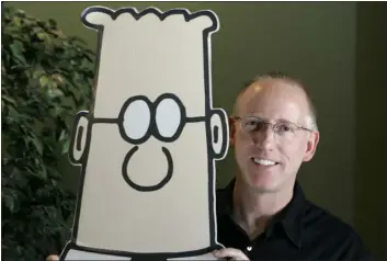  ?? MARCIO JOSE SANCHEZ — THE ASSOCIATED PRESS FILE ?? Scott Adams, creator of the comic strip Dilbert, poses for a portrait with the Dilbert character in his studio in Dublin, Calif. in 2006.