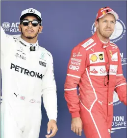  ??  ?? FIERCE RIVALS: Lewis Hamilton, left, and Sebastian Vettel both have four Formula One world championsh­ip titles to their names.