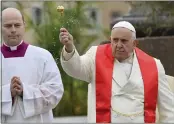  ?? POOL — FILIPPO MONTEFORTE ?? Pope Francis blesses the faithful with olive and palm branches before celebratin­g the Palm Sunday Mass in St. Peter's Square at The Vatican Sunday.