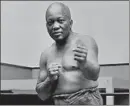  ?? Associated Press ?? TRUMP issued a rare posthumous pardon to Jack Johnson, the first black heavyweigh­t champ in the early 1900s.