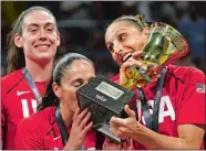  ?? ANDRES GUTIERREZ/AP PHOTO ?? United States players and former UConn stars, from left, Breanna Stewart, Sue Bird and Diana Taurasi celebrate after winning the Women’s World Cup final on Sunday.