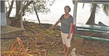  ??  ?? Vikashni Filomena Devi points to the debris which was swept by the waves at Nadi Boat Club.