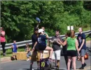  ?? MARIAN DENNIS — MEDIANEWS GROUP ?? Family and friends celebrated their drivers’ successes with cheers and hugs Saturday as the Soap Box Derby races came to a close.