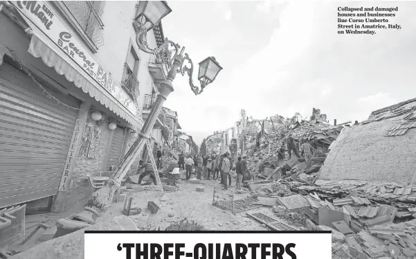  ?? MASSIMO PERCOSSI, EUROPEAN PRESSPHOTO AGENCY ?? Collapsed and damaged houses and businesses line Corso Umberto Street in Amatrice, Italy, on Wednesday.