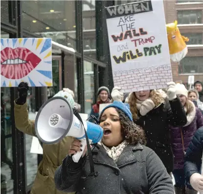  ??  ?? The organizer of the downtown Young Women’s March, Jazmine-Marie Cruz, leads demonstrat­ors around Federal Plaza on Saturday.