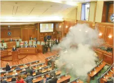  ?? (Agron Beqiri/Reuters) ?? OPPOSITION MEMBERS in the Kosovo parliament have been releasing tear gas recently as a form of protest, as shown in this incident in February.