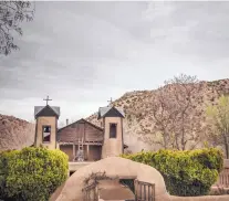  ?? ROBERTO E. ROSALES/JOURNAL ?? El Santuario attracts an estimated 300,000 visitors a year, particular­ly during Holy Week, when throngs fill the streets of the tiny village of Chimayó. The site has been a religious shrine since 1810.