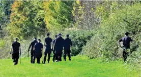  ??  ?? Taped off: Police search woodland near Miss Wellgreen’s home