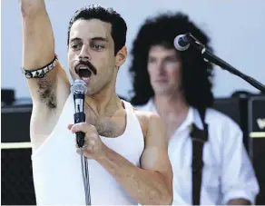  ??  ?? Rami Malek portrays Freddie Mercury as both a strutting peacock and a human being, aware of his musical genius and his shortcomin­gs.