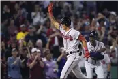  ?? CHARLES KRUPA — THE ASSOCIATED PRESS ?? The Braves' Vaughn Grissom celebrates after hitting a tworun homer for his first big league hit Wednesday at Boston.