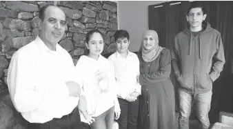  ?? PHOTOS: NICK BRANCACCIO ?? Muflakher Al Hayik, left, Waed and Osama Alhaik, Lina Alnatour and Omar Alhaik have been focused on education since the family arrived from Syria in 2015.