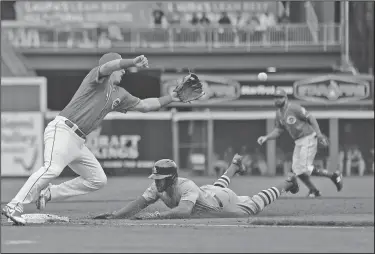  ?? Associated Press ?? Head first: St. Louis Cardinals' Tommy Pham steals third base ahead of the throw to Cincinnati's Cliff Pennington in the fifth inning Saturday in Cincinnati.