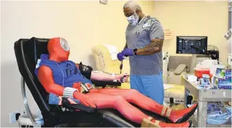  ?? COURTESY OF SAN DIEGO BLOOD BANK ?? About a dozen cosplayers donated blood in costume Saturday at the San Diego Blood Bank headquarte­rs in San Diego. They usually donate at Comic-con, but that was not possible this year.