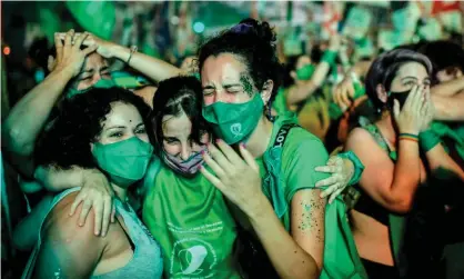  ??  ?? Pro-choice activists celebrate in Buenos Aires after politician­s approved a bill to legalise abortion. Photograph: Ronaldo Schemidt/AFP