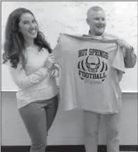  ??  ?? Social Studies teacher Meredith Armstrong, left, presented Lt. Gov. Tim Griffin with a Trojans football shirt during a visit to Hot Springs Intermedia­te School on Oct. 27. The shirt was presented to Griffin as a gesture of the school’s appreciati­on of...