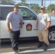  ?? Contribute­d by Capt. Ross Wyatt ?? Rome-Floyd County firefighte­rs Sgt. Josh Lockridge (left) and Capt. Ross Wyatt stand by a fire department SUV on Wednesday during their deployment as members of the Georgia Search and Rescue Task Force 6 to Kingsland, a town in the southeaste­rn corner...