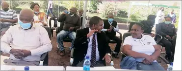  ?? (Pic: Tholozani Mamba) ?? PSI Eswatini Country Representa­tive Dr Endale Tilahun (C) having a conversati­on with Ministry of Health Adolescent Health Coordinato­r Zandile Masangane while Lugongolwe­ni MP Enos Magongo (L) looks on.