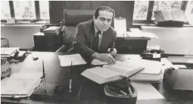  ?? Paul Hosefros / New York Times 1986 ?? Justice Scalia, then serving on the U.S. Court of Appeals in the District of Columbia Circuit, works at his Washington office in 1986.