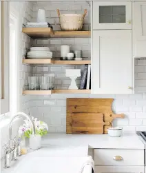  ?? JESSICA WHITE PHOTOGRAPH­Y ?? You can add dimension to standard subway tile by using ceramic tile with a bevelled edge.