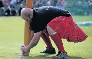  ??  ?? Tossing the caber One of the top events at the games