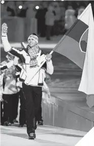  ?? MARK HUMPHREY/THE ASSOCIATED PRESS ?? TALL ORDER Zdeno Chara carries Slovakia’s flag in the 2014 Sochi Olympics’ opening ceremonies at Fisht Olympic Stadium.