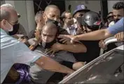  ?? Ramon Espinosa Associated Press ?? POLICE ARREST an anti-government protester in Havana on July 11, one of thousands to demonstrat­e.