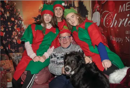  ??  ?? Joe Hanley pictured with his dog, Snapper, as he met Santa’s elves at the Ballyduff Christmas Market on Sunday afternoon.
