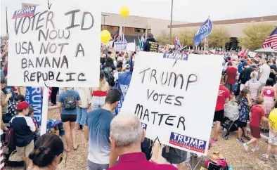  ?? ROSS D. FRANKLIN/AP ?? Supporters of President Donald Trump attend a rally Nov. 6 outside the Maricopa County Recorder’s Office in Phoenix.