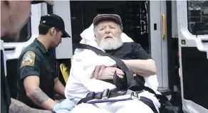  ?? ABC VIA THE ASSOCIATED PRESS ?? Jakiw Palij, a former Nazi concentrat­ion camp guard, is carried on a stretcher from his home in New York into a waiting ambulance on Monday.