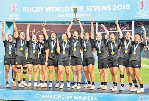  ??  ?? Members of the New Zealand women’s rugby team celebrate after winning the Championsh­ips Final against France at the Rugby Sevens World Cup in the AT&amp;T Park at San Francisco, California. — AFP Photo