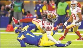  ?? Allen J. Schaben Los Angeles Times ?? RAMS WIDE RECEIVER Allen Robinson hits the turf after a pass was def lected by 49ers linebacker Fred Warner. The Rams’ offense sputtered again.