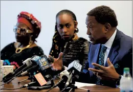  ?? RAY CHAVEZ — STAFF PHOTOGRAPH­ER ?? Amaka Okobi, left, and her daughter Ebele Okobi sit next to attorney John Burris as he talks about Chinedu Okobi’s 2018 death during a news conference in Oakland on May 31, 2019. Okobi died after he was tased seven times by San Mateo County deputies.