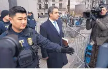  ?? CRAIG RUTTLE/ASSOCIATED PRESS ?? Michael Cohen, President Donald Trump’s former lawyer, leaves federal court Wednesday after his sentencing in New York. Trump now says any hush-money settlement­s would not be illegal.