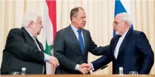  ?? AP ?? Russian Foreign Minister Sergey Lavrov, Iranian Foreign Minister Javad Zarif and Syrian Foreign Minister Walid Muallem greet each other after a joint Press conference in Moscow on Friday. —