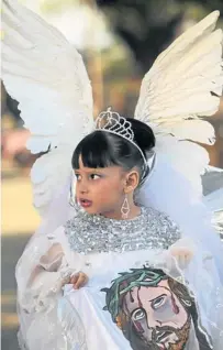  ?? Picture: REUTERS ?? A girl dressed as an angel takes part in a Good Friday procession in Masaya city, south of Managua, Nicaragua. Holy Week is celebrated in many Christian traditions during the week before Easter