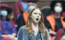  ?? ?? Full voice . . . Soprano Olivia Pike sings during the University of Otago 1pm graduation ceremony.