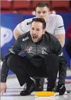  ??  ?? The Associated Press
Brad Thiessen watches as John Epping calls a shot during the Brier in Brandon, Man., on March 1, 2019.