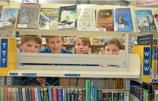  ?? PHOTO: FAIRFAX NZ ?? Harry Hampton, Archie Chandler, Tom Adams and William Chandler, are world champions in children’s literature. Archie and William are twins.