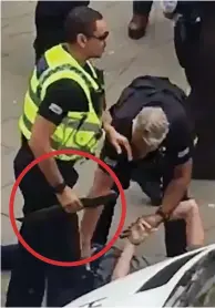  ??  ?? Held down: Police take the blade, circled