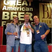  ?? HANDOUT ?? Moylan’s and Marin brewing companies owner Brendan Moylan, center, celebrates winning seven medals at the Great American Beer Festival in Denver in 2007.