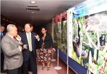  ??  ?? Rasid (left), Lau (second left) and others tour the exhibition at the event.