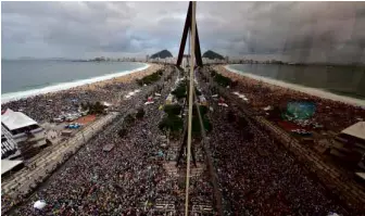  ?? WINDSWEPT PONTIFF Pope Francis addresses thousands of young people at Rio de Janeiro’s iconic Copacabana beachfront in Brazil during World Youth Day on July 25. The first Latin-American and Jesuit Pontiff arrived in Brazil mainly for the huge five-day Cat ??