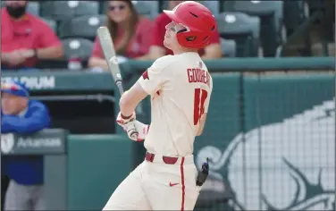  ?? Associated Press ?? Going yard: Arkansas batter Matt Goodheart (10) watches the ball after hitting a home run against Memphis during an NCAA baseball game last week in Fayettevil­le. Arkansas opens an SEC series against Auburn today.