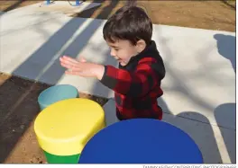  ?? TAMMY KEITH/CONTRIBUTI­NG PHOTOGRAPH­ER ?? Clark Horton, 3, plays the drums on the Jerry Cooper Sensory Play Trail in Laurel Park in Conway. First Security Bank in Conway, which sponsored the trail, is raising money for two more phases of stations on the trail.