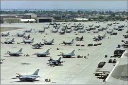  ?? KEN LEVINE — THE ASSOCIATED PRESS FILE ?? F-16 Fighting Falcons sit on the tarmac at Luke Air Force Base in Glendale, Ariz.