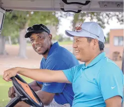  ?? ROBERTO E. ROSALES/JOURNAL ?? Former NBA All-Star Sean Elliott, left, rides a golf cart with New Mexico native Notah Begay III as they prepare to play a round of golf at the Santa Ana Golf Course on Friday. They were participat­ing in Begay’s inaugural New Mexico Grande Slam charity...