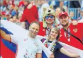  ?? AP PHOTO ?? Russian fans are in celebrator­y mode after their team’s superb opening day win against Saudi Arabia.