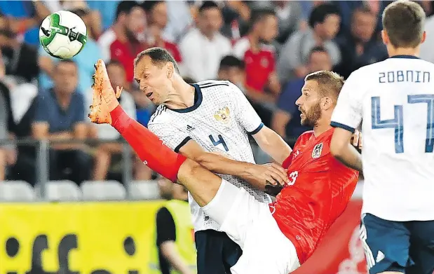  ?? — GETTY IMAGES FILES ?? Russian legend Sergei Ignashevic­h, left, has been brought out of retirement to boost the host’s defence for the World Cup.