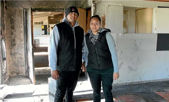  ??  ?? Peter Poharama and Tiana Apiata inside the damaged building used for their youth centre.